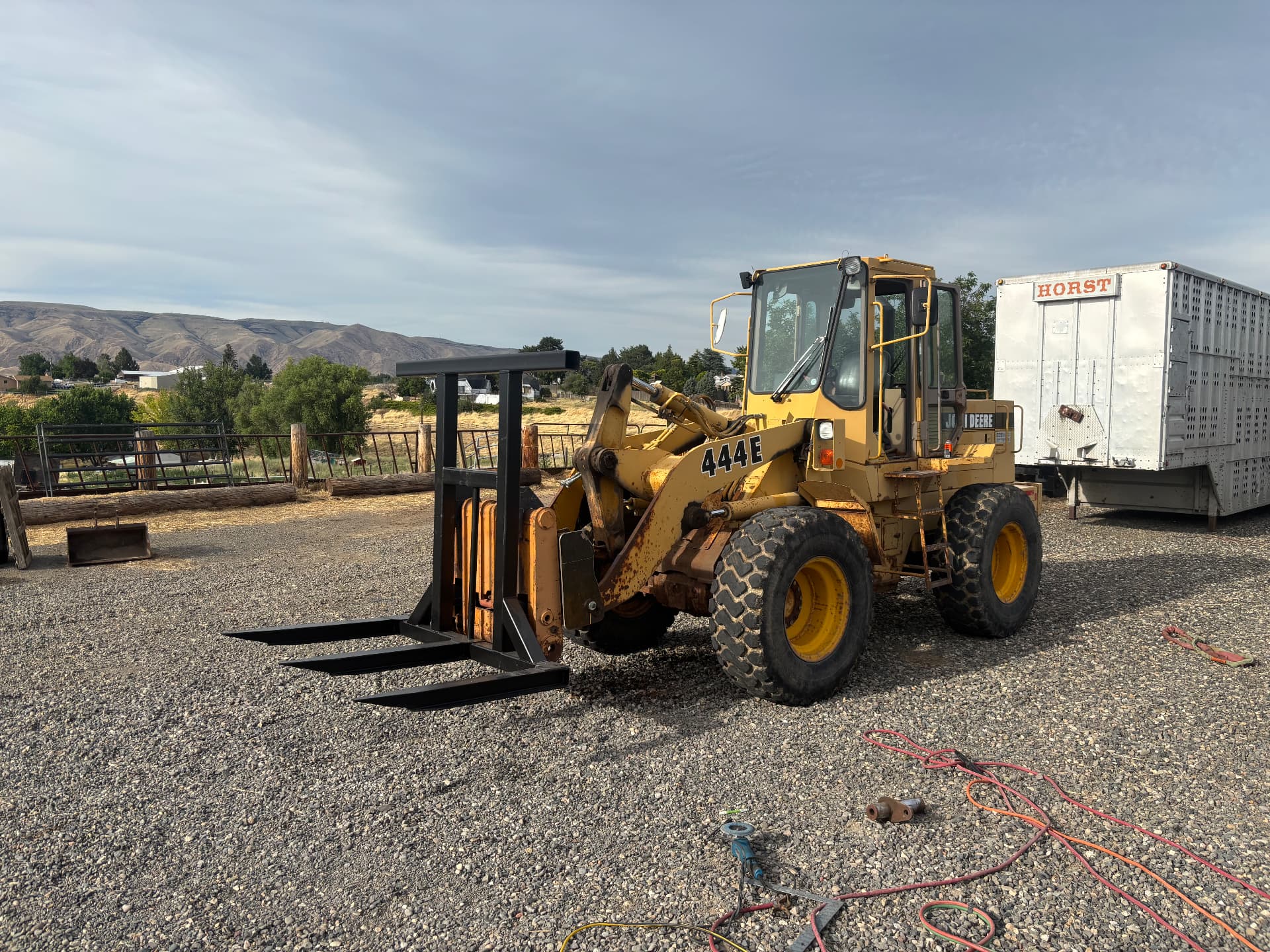 Custom fabricated pallet fork attachment installed on a wheel loader