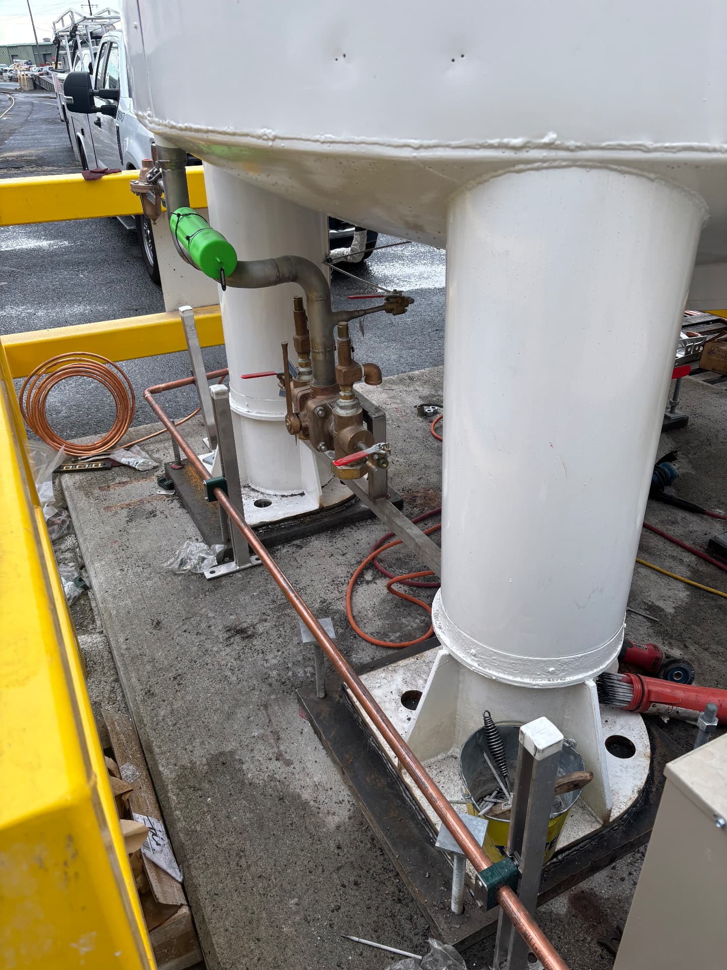 Valve manifolds and tank support legs during installation