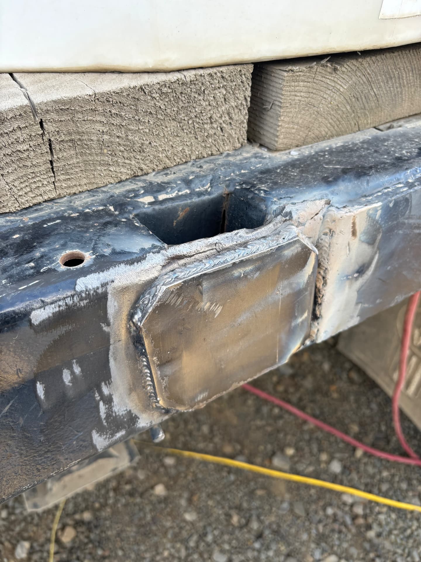 Patch plate welded into a worn section of a trailer frame